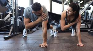 Toning Bingo Wings: Your Ultimate Guide to Sculpting Sleek Arms at the Gym 3 Fitness trainer demonstrating arm toning exercises Rhyl