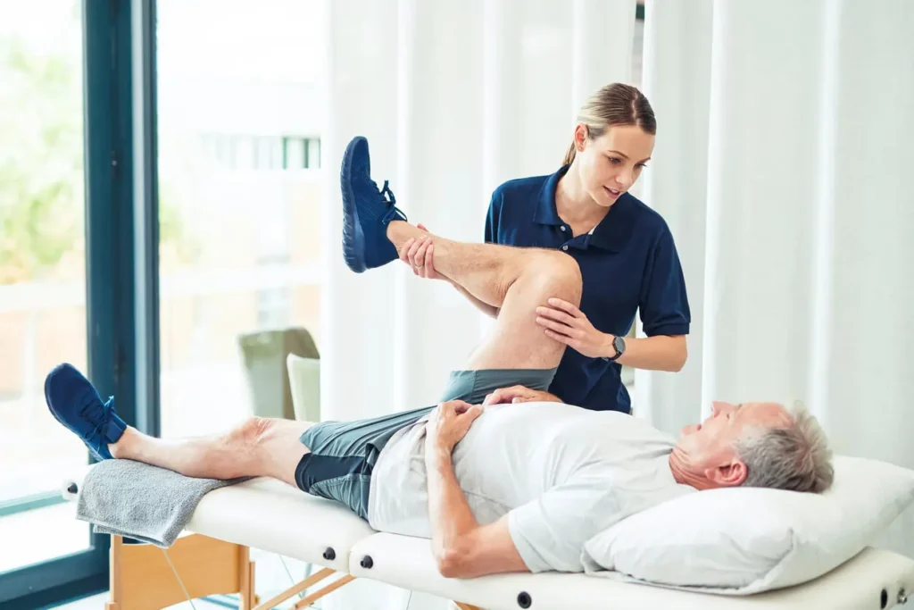 Revitalising Recovery: Effective Rehabilitation Strategies for Muscle Injuries 3 Physiotherapist assisting a patient with muscle recovery exercises Rhyl
