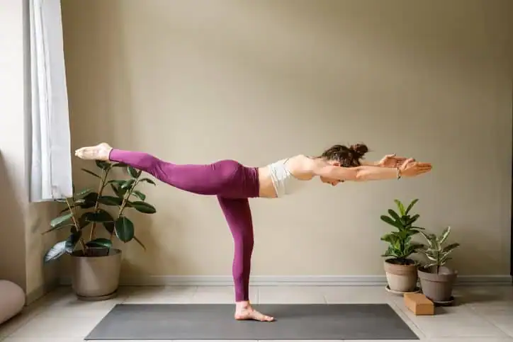 Woman doing Yoga exercise Rhyl to help with toning the body. 